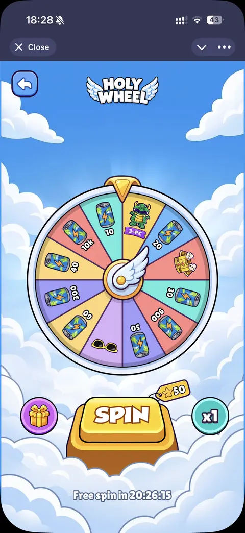 Pebbler Holy Wheel screen with a colourful prize wheel and a large Spin button